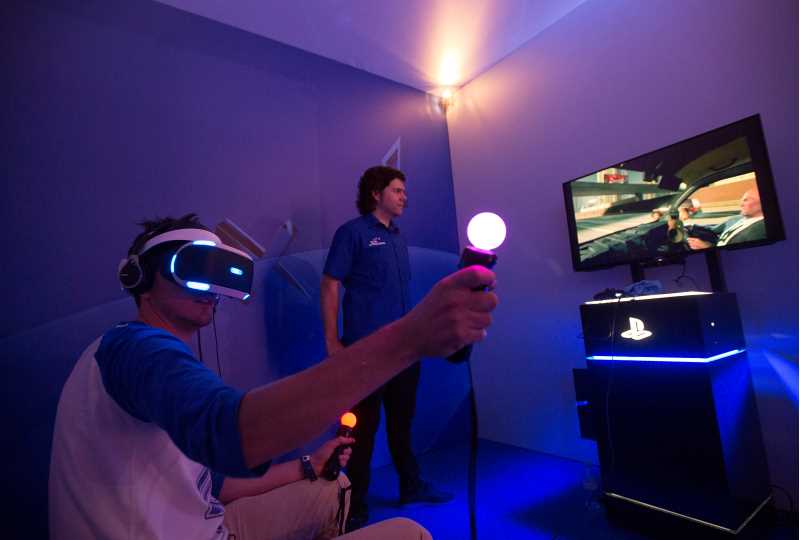 Photo of a person using Sony's VR glasses and PlayStation.